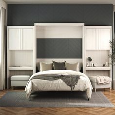 a bedroom with gray walls and white furniture, including a large bed in the center