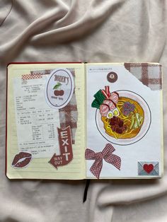 an open notebook with some food on it