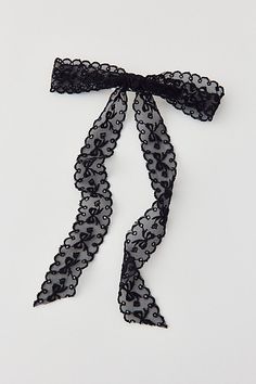 Femme hair barrette topped with a sheer lace bow for a coquette cool look. Features Medium lace hair bow barrette Lace bow barrette Sheer lace Long bow style Secure barrette back with long sheer lace Content + Care Mixed metal, nylon Hand wash Imported | Medium Lace Hair Bow Barrette in Black, Women's at Urban Outfitters Bridesmaid Hair Bows, Lace Hair Bow, Black Hair Bow, Black Hair Bows, Long Bow, Bow Barrette, Bow Style, Lace Hair, Lace Bows