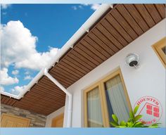 the outside of a house with a sky background