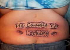 a pregnant belly with the words ha caught ya looking tattooed on it's side