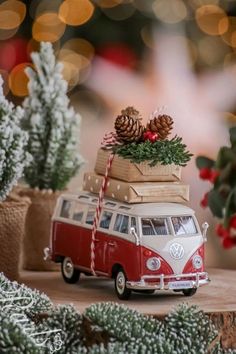 a red and white vw bus with presents on top