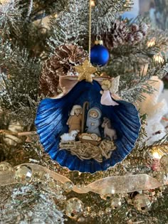 a christmas ornament hanging from the top of a tree