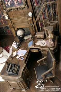 there is a desk and chair in the room with bookshelves on the wall