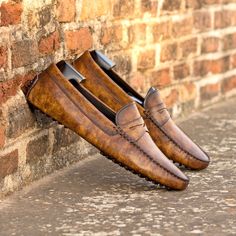 You can also refer to them as "driving loafers" or just "drivers". They are essentially a mocassin-construction slipon with a snug but comfterble fit. The defining feature are the small rubber pebbles that cover the sole and extend to the back of the heel. They are very flexible and provide an added grip. Expertly engineered to keep you two feet comfterble as possible while navigating the road on four wheels, the driving mocassin was the footwear equivalent of the italian auto spirit, marrying l Mens Driving Loafers, Patina Style, Driving Shoes Men, Golf Shoes Mens, Driving Loafers, Dress Shoes Womens, Driving Shoes, Stylish Shoes