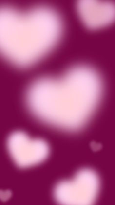 blurry image of hearts on purple background