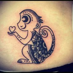 a black and white tattoo of a monkey holding a heart