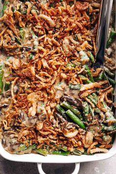 a casserole dish filled with green beans and mushrooms