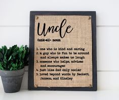 a sign that says uncle next to a potted plant