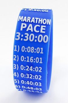 a close up of a blue wristband with numbers on it and the words marathon pace 3 30 00