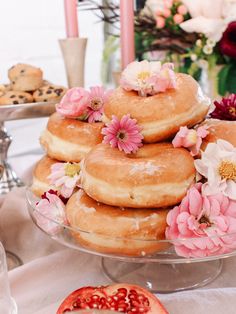 there are many doughnuts on the glass platter