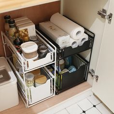 an organized pantry is shown in the corner of a kitchen cabinet with shelves and bins