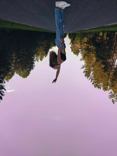 a woman is upside down in the water