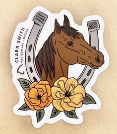 a sticker with a horse and flowers on it