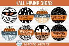 fall round signs with pumpkins and black and orange designs on them, in front of a brick wall