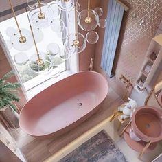 an aerial view of a pink bathtub in a bathroom