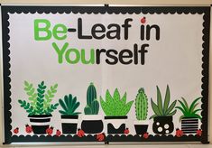 a bulletin board that says be - leaf in yourself with potted plants on it