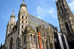 a large cathedral with tall spires against a blue sky