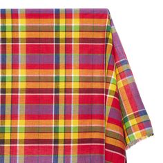 a multicolored plaid blanket folded on top of each other