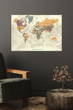 a chair and table in front of a wall with a map on the wall above it