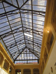 the inside of a building with a glass roof