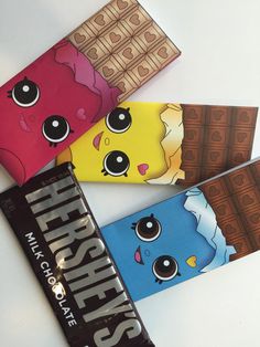 four chocolate bar wrappers with cartoon characters on them, one for hershey's and the other for pikachu's