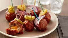 meatballs with onions and ketchup on a plate