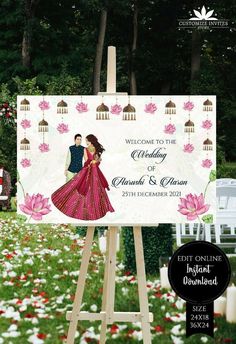 an easel with a wedding sign on it in the middle of flowers and trees