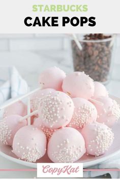 pink cake pops on a white plate with the words starbucks's cake pops over it