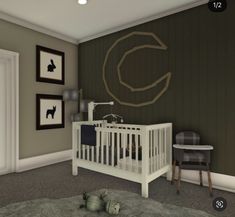 a baby's room with a crib, rocking chair and pictures on the wall