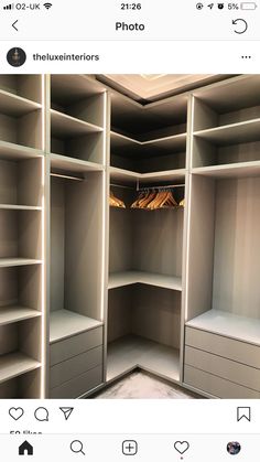 an empty walk in closet with shelves and drawers