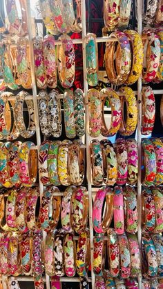 many different colored bracelets are on display