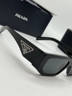 Brand new Prada PR09ZS Sunglasses in Black.Featuring a black rectangular acetate frame with dark grey lenses.Silver metal plaque Prada logos on temples.Measures 54-18-140. Unisex.100% authentic and unworn.Made in Italy.Box, case, cloth and paperwork included. Retail price $560. Visual Wishlist, Prada Shades, Prada Aesthetic, Men's Eyeglasses, Metal Plaque, Grey Lenses, Jimmy Choo, Dark Grey