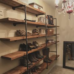 the shoe rack has many pairs of shoes on it