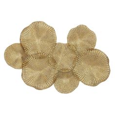 four gold plates on a white background