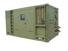 the back side of a large green box with two doors and some wires in it