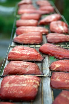 raw meat is being prepared on the grill