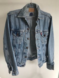 Vintage stone washed distressed blue colour Levi's denim jacket. 100% Cotton. In good used condition. UK size S. RETURN POLICY: I do not accept refund - only if the item is Faulty or description or photo does not match the item received. Unfortunately as this is very small bussiness and we only have one example of each item, and can't afford for pieces to be out for weeks of our shop as it could mean loss of potential sales. I gladly accept exchanges though, I'm also happy to send you any additional pictures /video/ measurements of the item to give you the best idea of fit etc. Vintage items have been around twenty years or more And the fact that it withstands the test of time by both remaining fashionable and not deteriorating after a short while or small amount of use. However they have Levis Denim Jacket, Levis Denim, Blue Colour, The Twenties, Favorite Outfit, Levi's, Return Policy, Denim Jacket, Gender Neutral