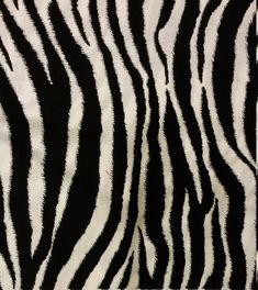 a zebra print fabric with black and white stripes