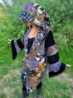 Cotton patchwork witch and or wizard cloak with a lightweight flannel lining and a long pointy oversized hood and oversized bell sleeves. Size is a unisex medium/large. I am wearing it in the photos and am a womens medium and 5'9. Two pockets and three buttons down the front. Wizard Cloak, Wizard Robe, Witch Cloak, Romanian Clothing, Wizard Robes, Scarecrow Costume, Upcycle Clothes Diy, Boho Clothes, Altered Couture