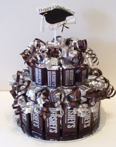 a cake made out of chocolate bars and ribbons