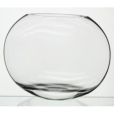 a glass bowl sitting on top of a table