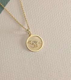 14K Real Solid crow gold necklace ● Material of pendant: Solid Gold 14k ( REAL GOLD ) ● Metal Stamp: 14L ( REAL GOLD ) ● The pendant is available in 6 sizes: - 14,0 mm / 0,55 inches ( Diameter ) In the photos - 15,3 mm / 0.60 inches ( Diameter ) - 16,5 mm / 0,65 inches ( Diameter ) - 19,1 mm / 0,75 inches ( Diameter ) - 21 mm / 0,82 inches ( Diameter ) - 23 mm / 0.90 inches ( Diameter ) ( In the photos the size is 14mm / 0.55 inches Diameter ) ( Jump Ring inner diameter: 4 mm ) ● Material Of Cha Crow Pendant, Crow Necklace, Schmuck Gold, Crow Bird, Celtic Mythology, Bird Jewelry, Gold Coin, Gold Coins, Jewelry Gold