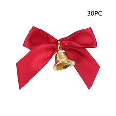 a red bow with a bell on it's side and a gold bell in the middle