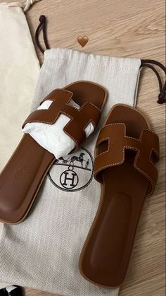 Hermes Oran Sandals Aesthetic, Heels Dior, Sneakers Louis Vuitton, Sandals Chanel, Shoes Ysl, Hermes Oran Sandals, Prada Boots, Staple Shoes, Uggs Boots