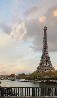 the eiffel tower in paris, france is seen from across the seine river