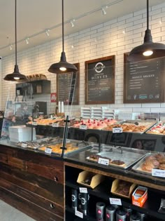 the inside of a bakery with lots of pastries