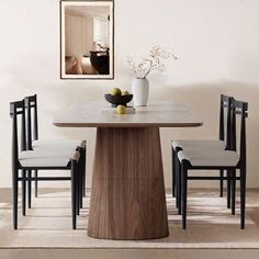 a dining table with four chairs around it