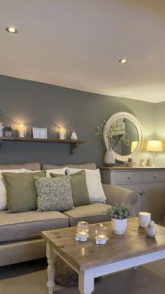 a living room with two couches and a coffee table in front of the window