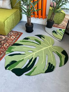 Our Monstera rug is the perfect addition to your cozy home. With its eye-catching monstera shape design, this fluffy accent rug adds an unforgettable aesthetic charm to your space. Perfect for nature-inspired decorators, this unique piece of decor will be admired by every guest that steps through your door. The soft material of the rug feels warm and inviting when stepped on, making it an ideal choice for living rooms and bedrooms alike. So if you're looking for something a little out of the ordinary to complete the look of any room in your house, then make sure to get yourself our monstera shaped accent rug. It will have you feeling like you're in paradise as soon as you step into the room! 💠MATERIALS: Our area rug is made of 100% acryl which is very pleasant to the touch.  💠COLORS: Gre Unforgettable Aesthetic, Plant Rug, Rug Cute, Living Room Floor, Rug Modern, Living Room Flooring, Form Design, Accent Rug